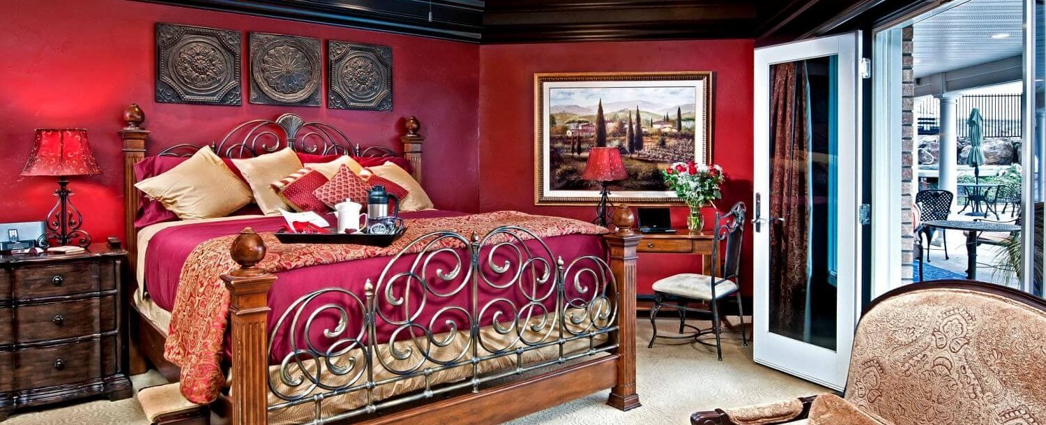 Spanish Suite - Room - Wide View of bed, small desk, nightstand and outdoor seating area just out the door